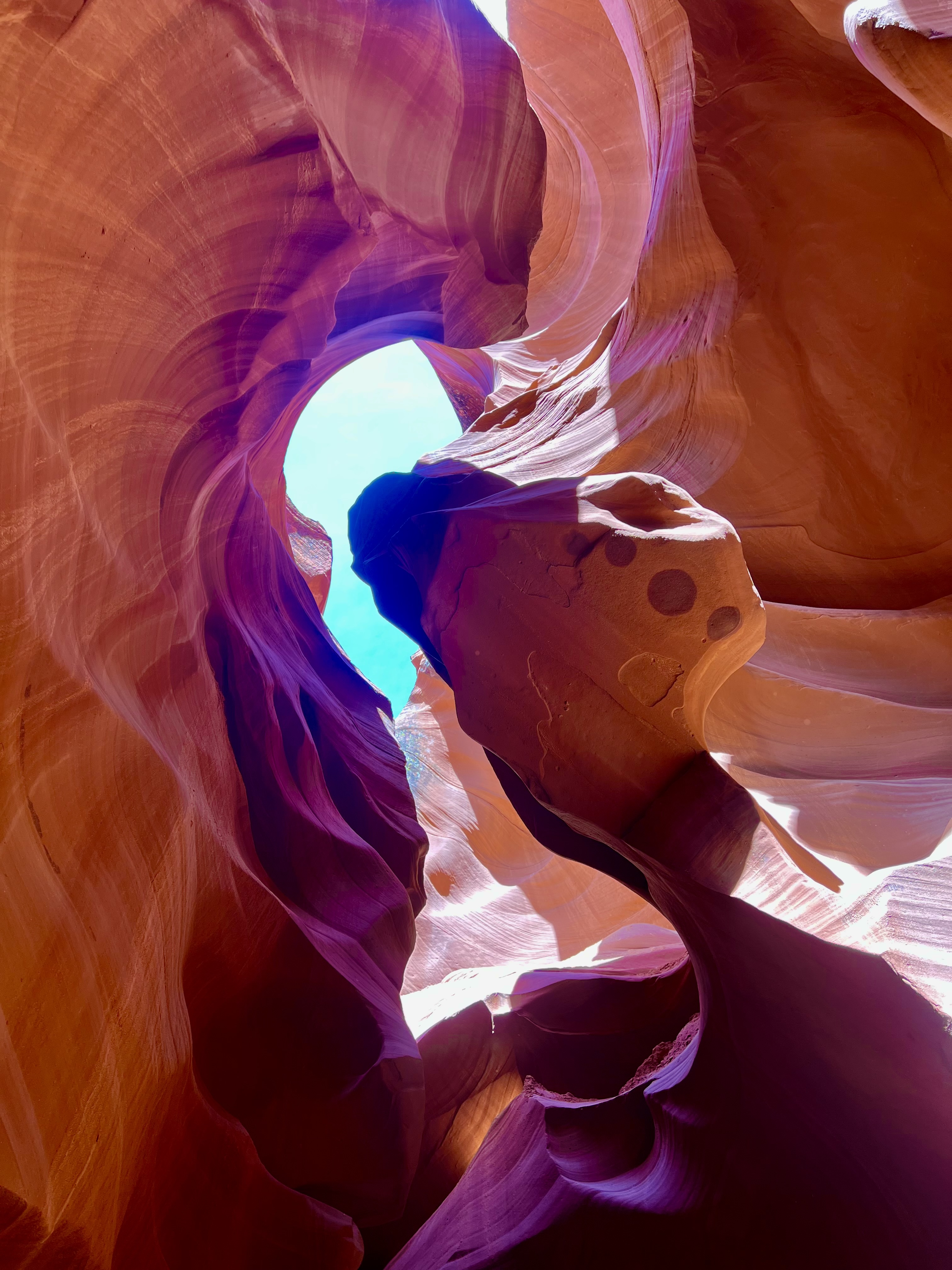 A person is inside of an antelope canyon.