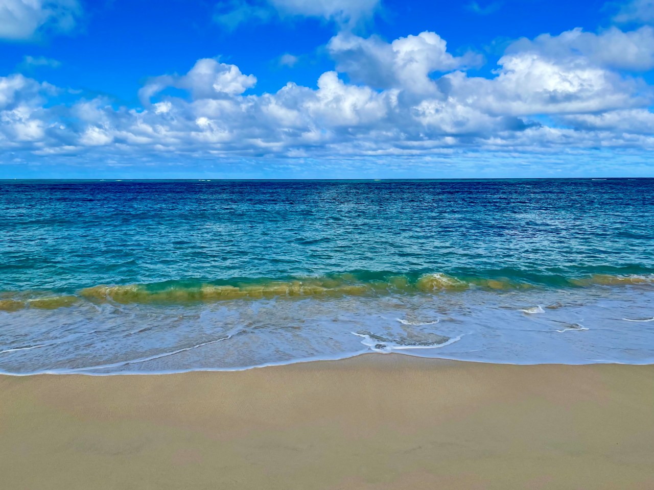 Calm clear blue ocean on a beach