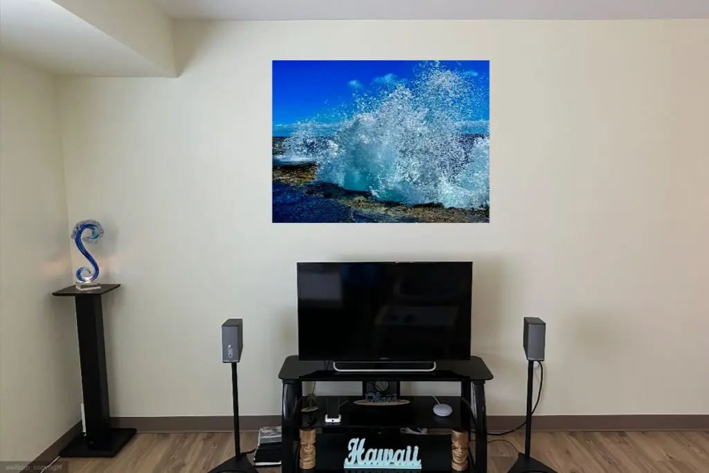 A television and speakers in front of a wall.