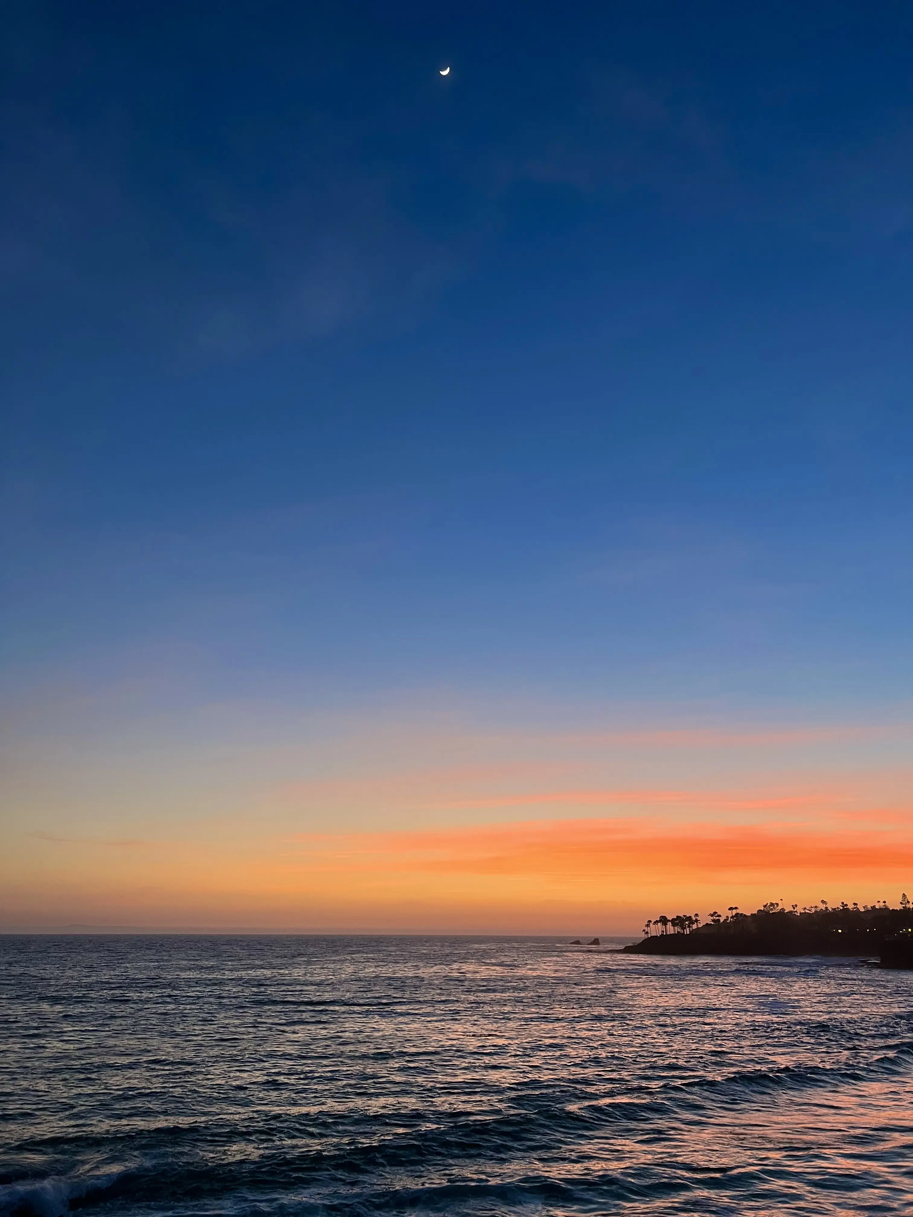 Orange sunset at twilight overlooking the ocean