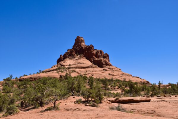 A large rock formation on top of a hill.